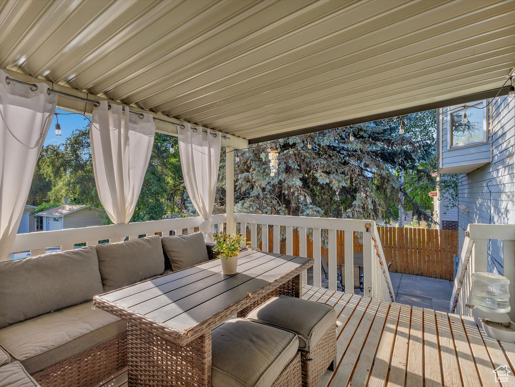 Wooden terrace with an outdoor hangout area