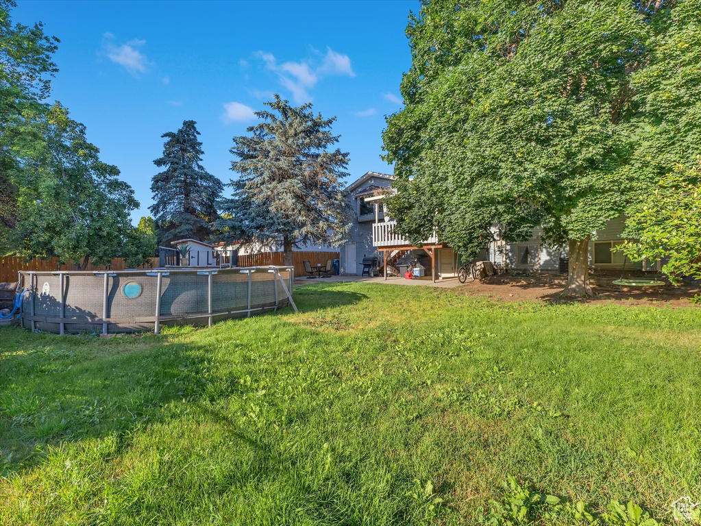 View of yard featuring a storage unit