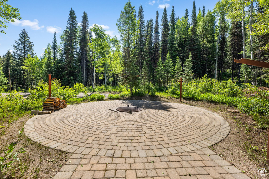 View of patio featuring an outdoor fire pit