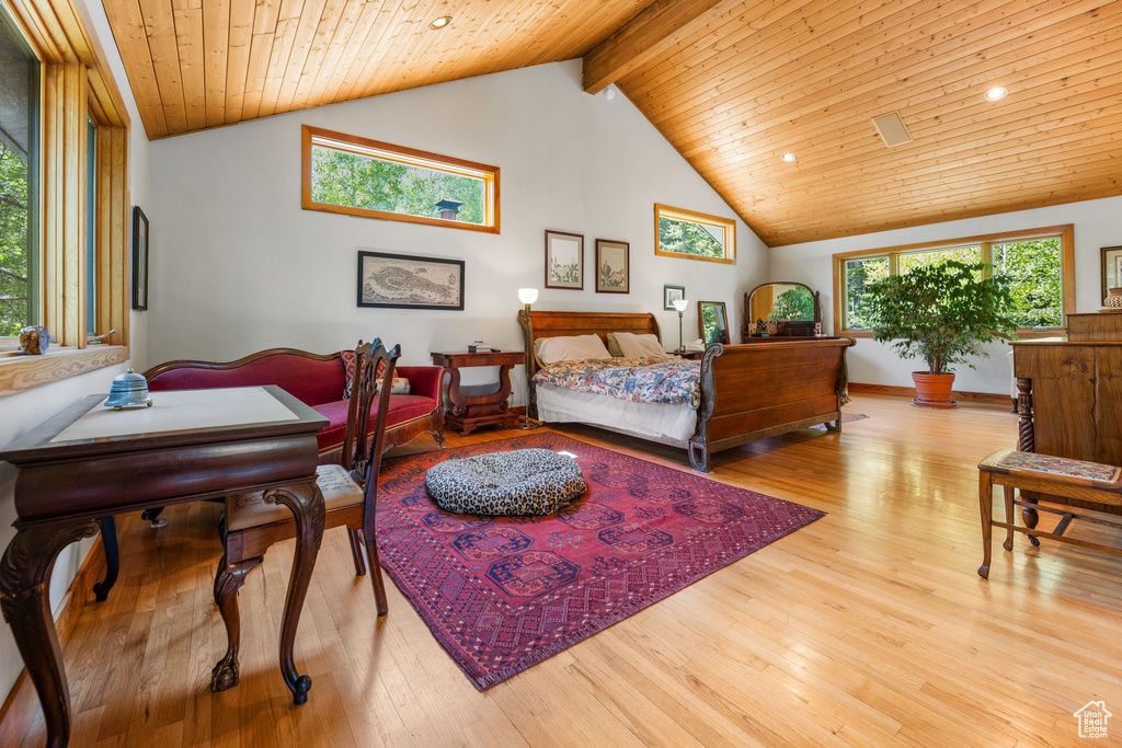 Bedroom with beam ceiling, wooden ceiling, high vaulted ceiling, and light wood-type flooring
