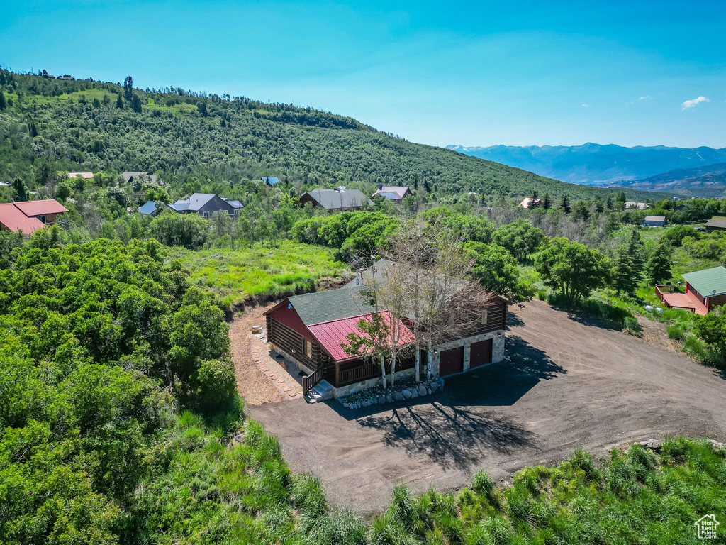 Birds eye view of property with a mountain view