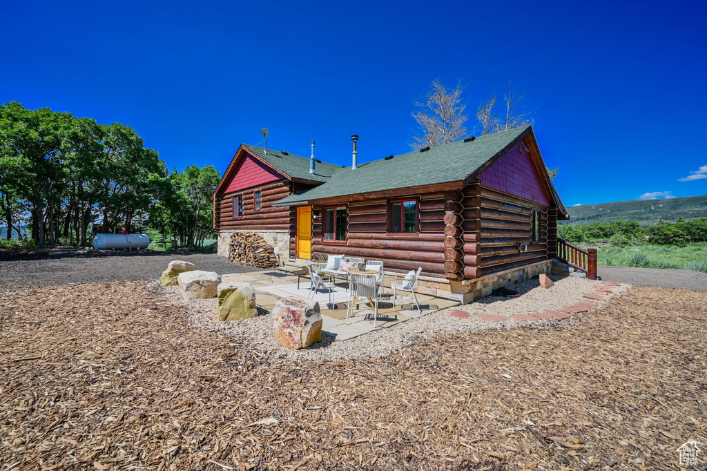 View of front of home featuring a patio