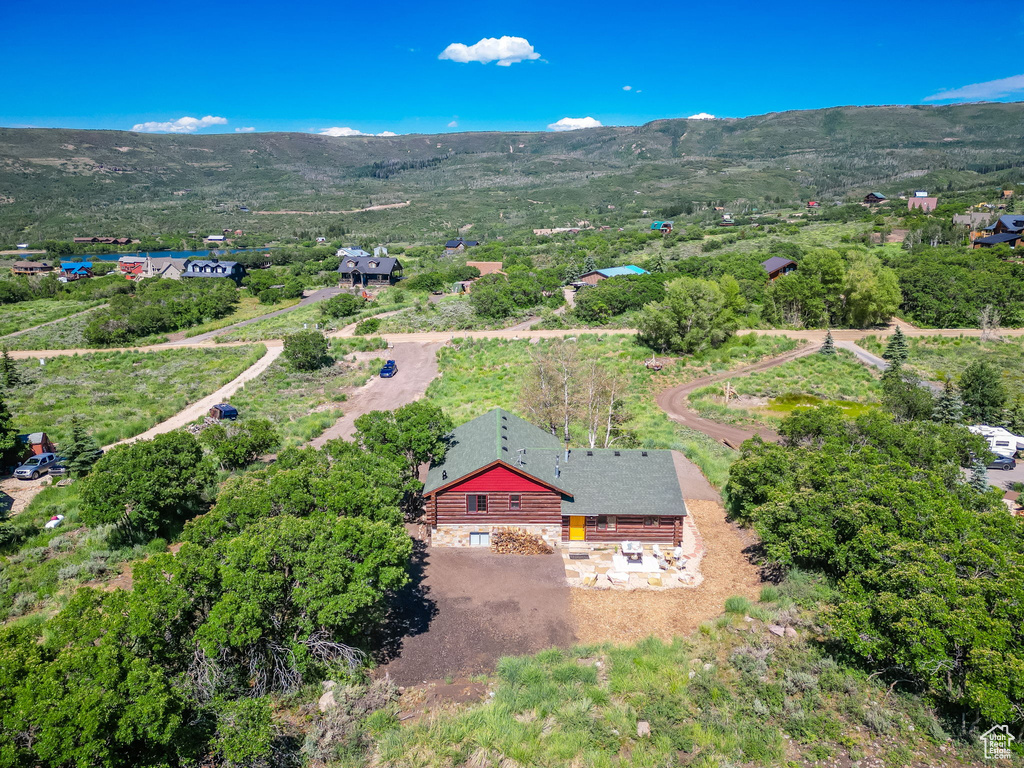 Birds eye view of property with a mountain view