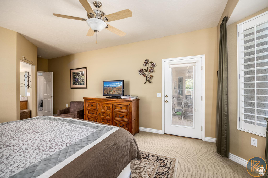 Bedroom featuring ceiling fan and light colored carpet