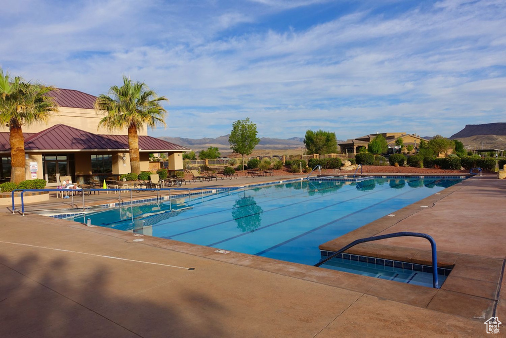 View of pool featuring a patio area and a mountain view