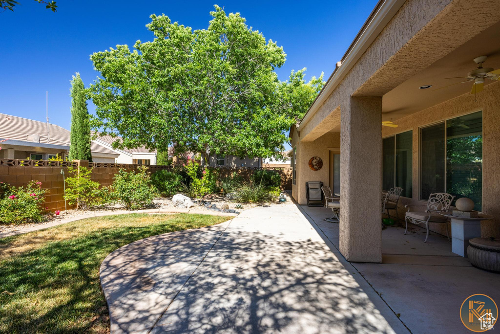 View of patio featuring ceiling fan