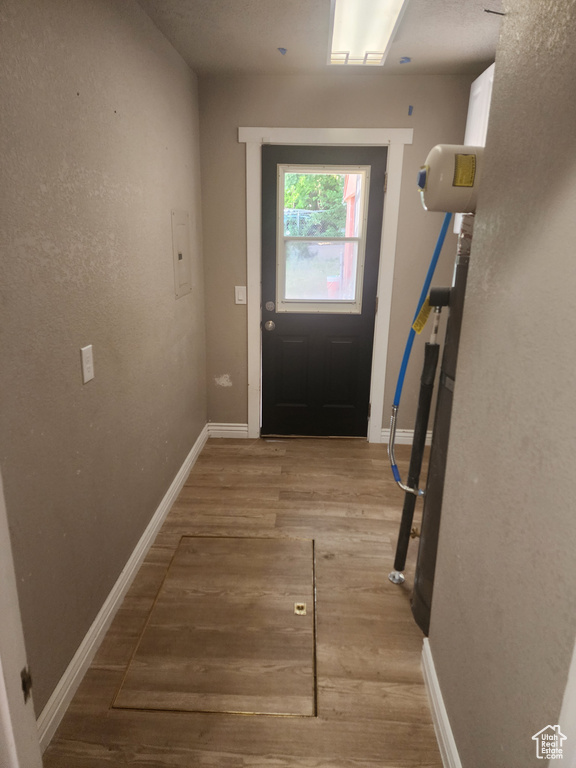 Doorway to outside featuring wood-type flooring