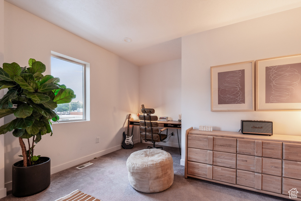 Living area featuring carpet flooring