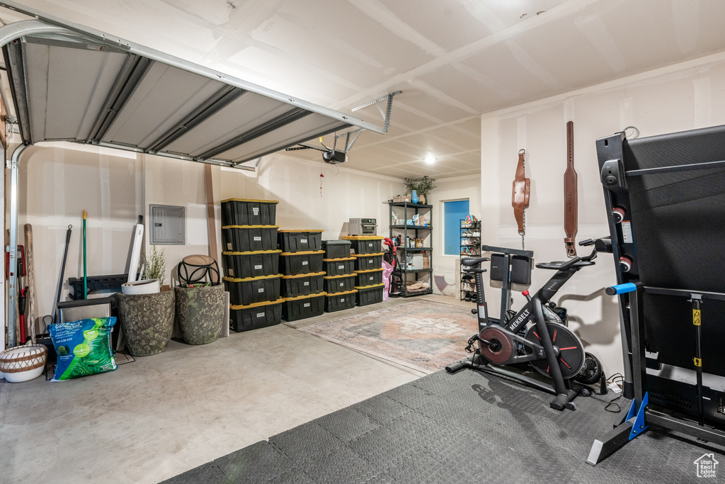 Exercise area with electric panel and concrete flooring