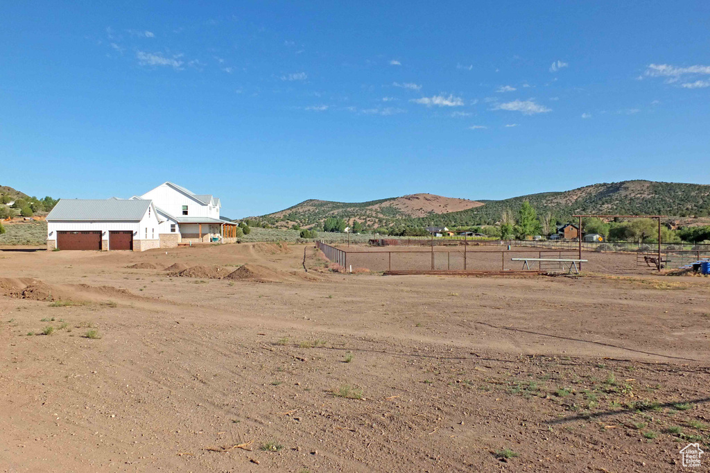 View of yard with a mountain view and a rural view