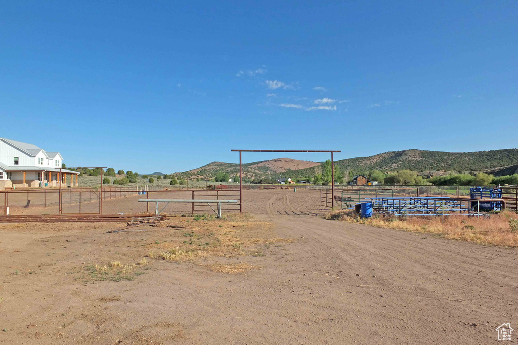 View of yard featuring a mountain view and a rural view