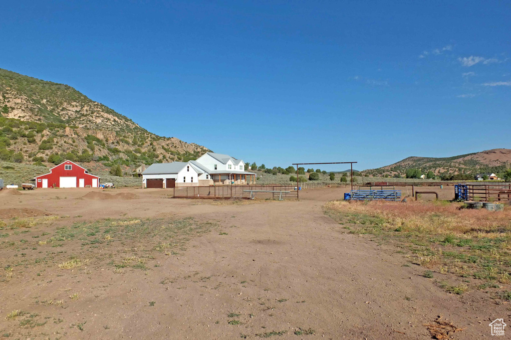 View of yard with a mountain view and a rural view