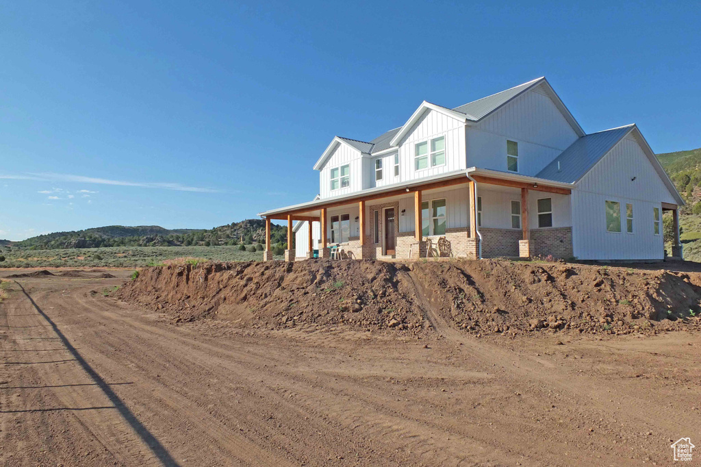 View of front of property featuring a porch