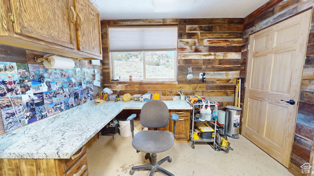 Office space featuring wooden walls