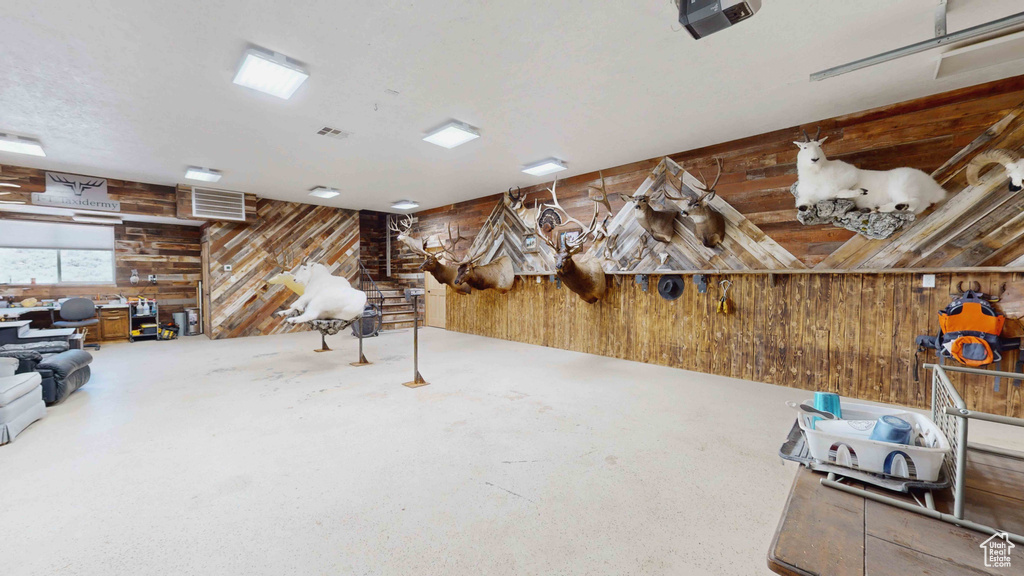 Misc room featuring wood walls