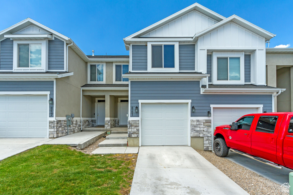 View of front facade featuring a garage