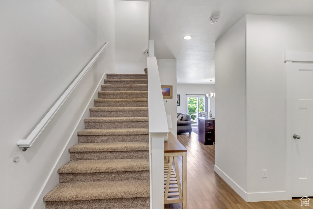 Stairway with hardwood / wood-style flooring