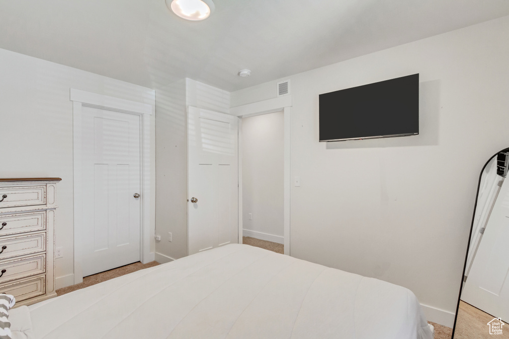 Bedroom featuring a closet and carpet floors