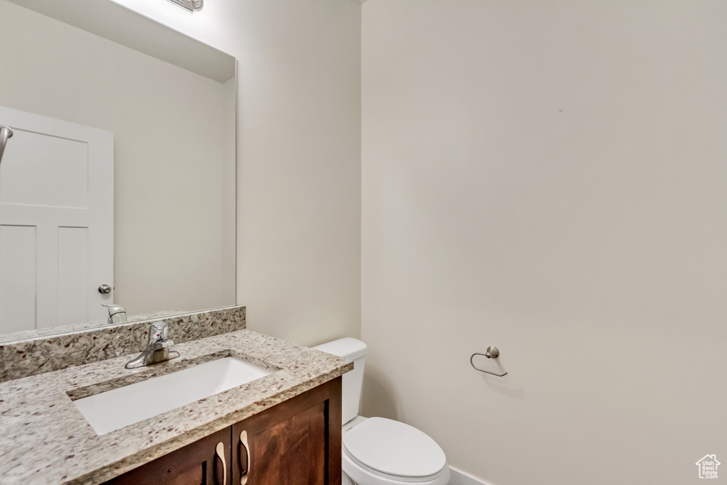 Bathroom featuring toilet and vanity