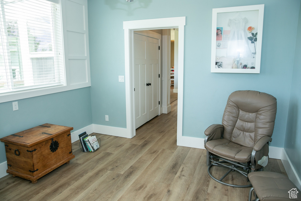 Sitting room featuring light hardwood / wood-style floors