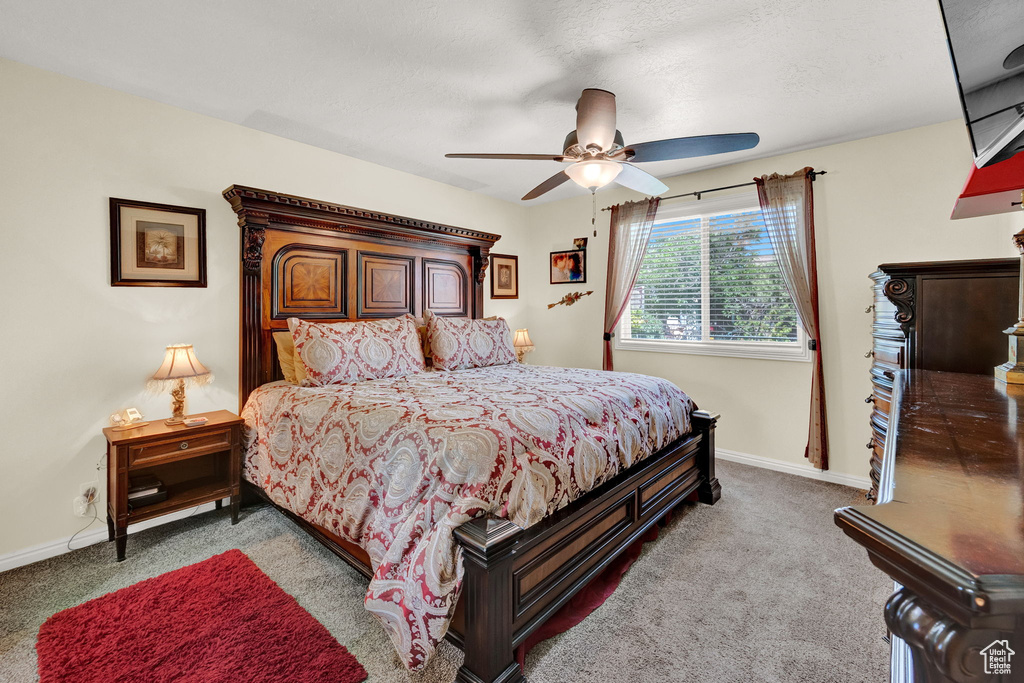 Bedroom with carpet flooring and ceiling fan