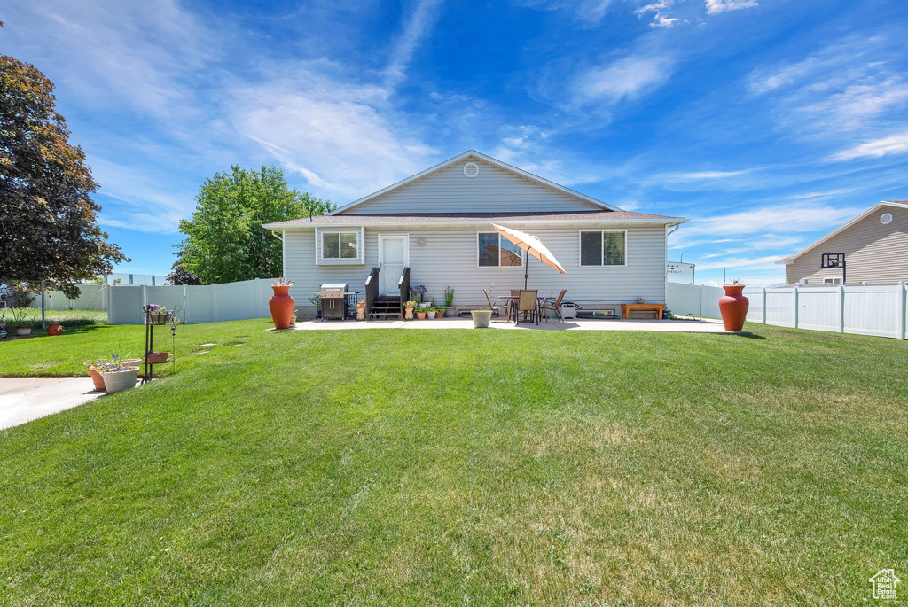 Exterior space featuring a yard and a patio area