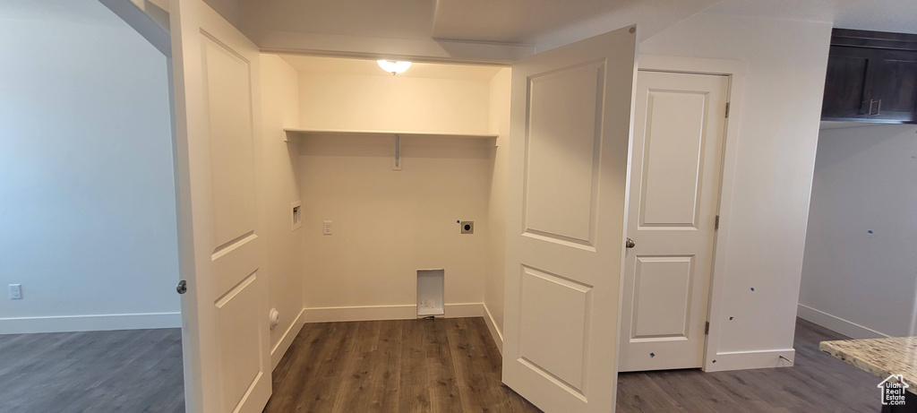 Washroom featuring dark hardwood / wood-style flooring and electric dryer hookup