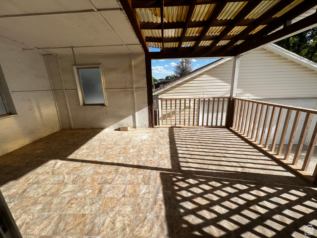 Wooden terrace with a patio area