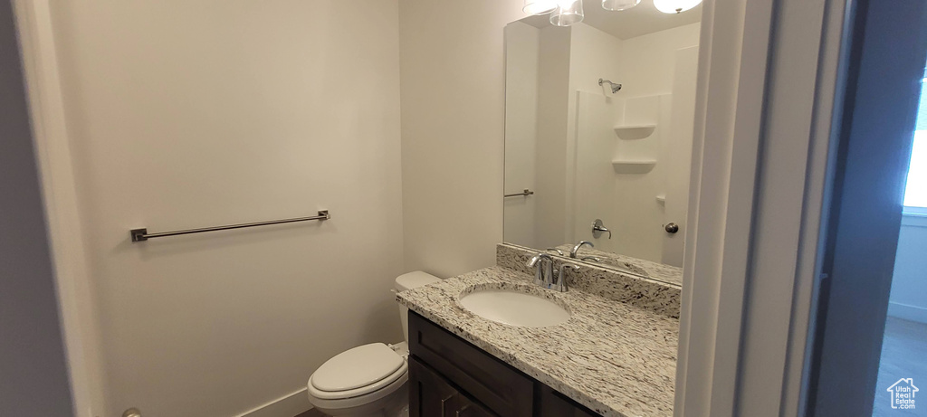 Bathroom featuring vanity and toilet