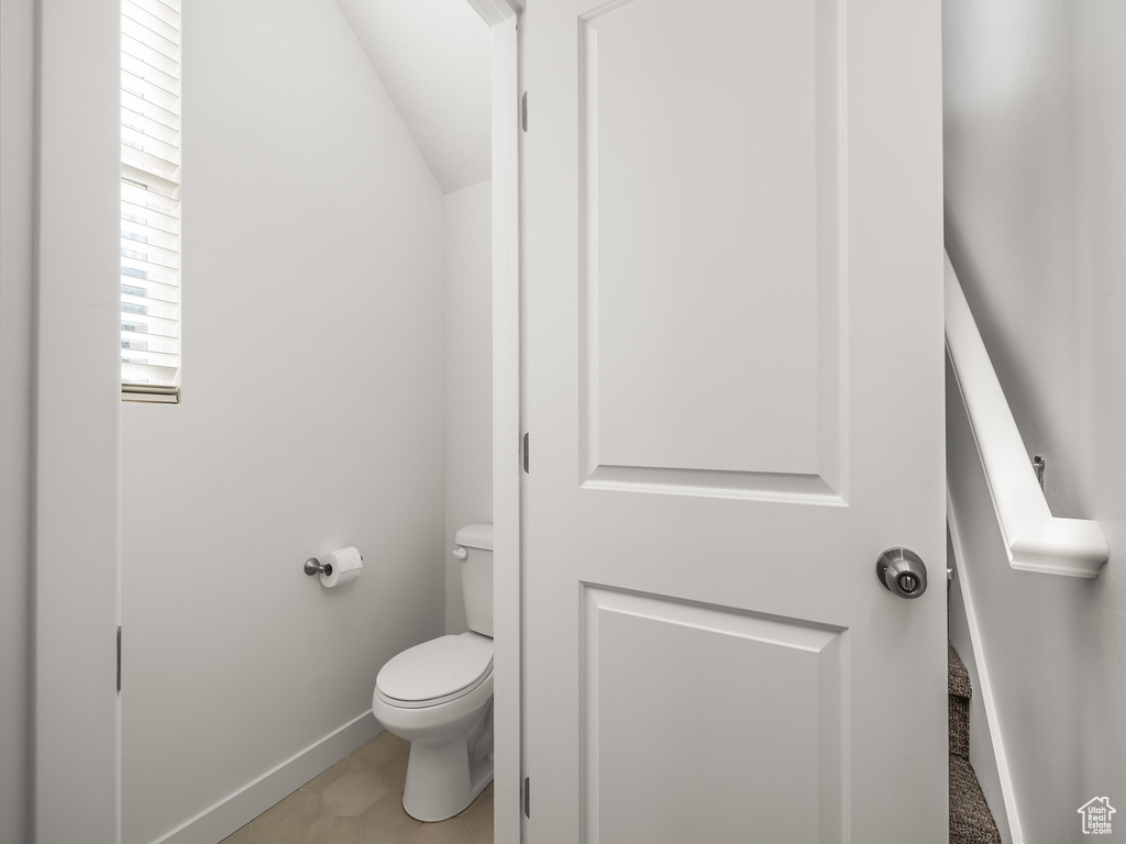 Bathroom with tile patterned floors and toilet