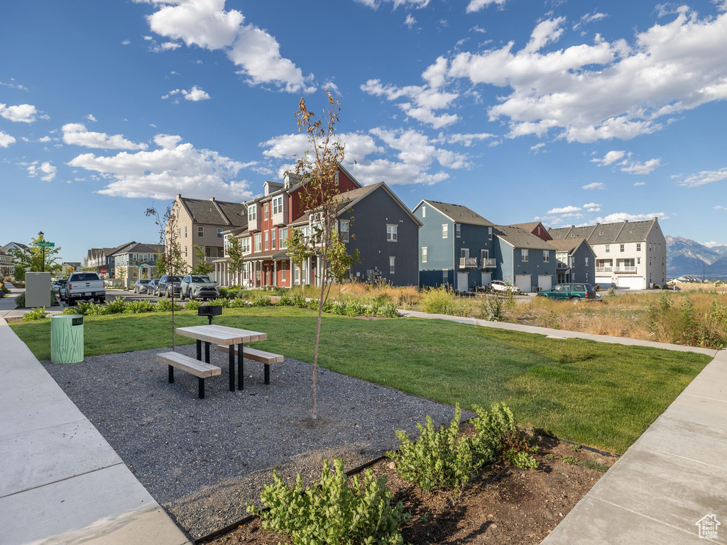 View of property's community with a lawn