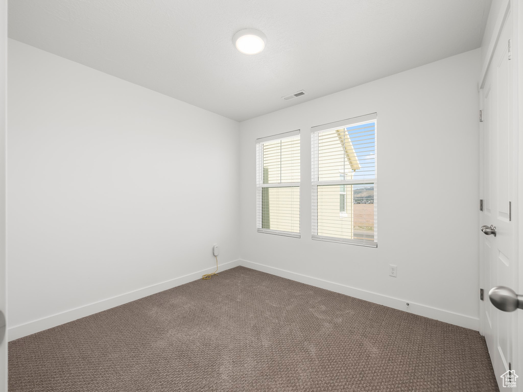 View of carpeted spare room