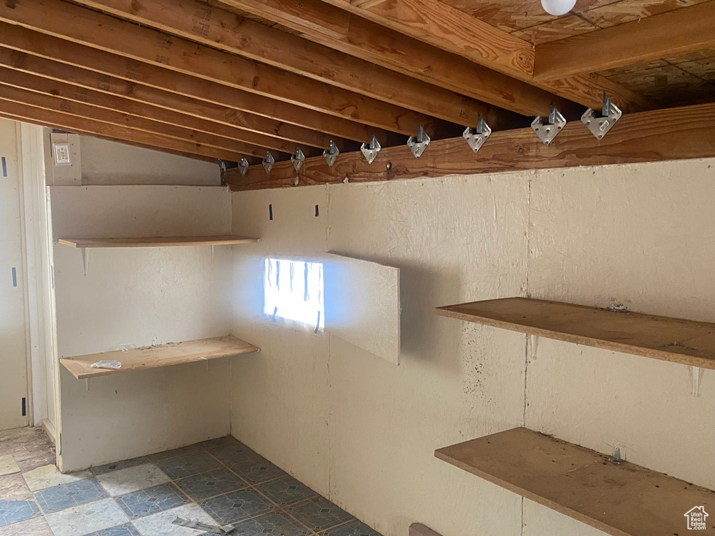 Basement featuring tile patterned flooring