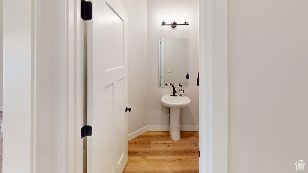 Bathroom featuring sink and hardwood / wood-style flooring