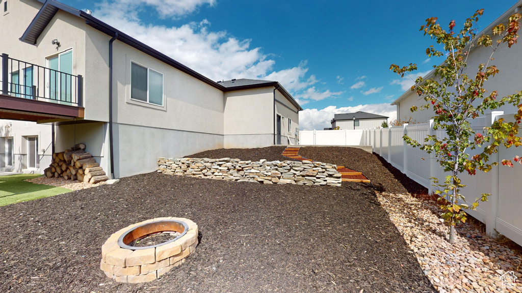 View of yard featuring a fire pit