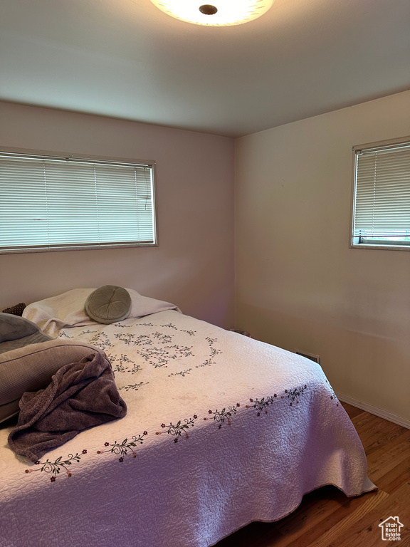 Bedroom featuring wood-type flooring