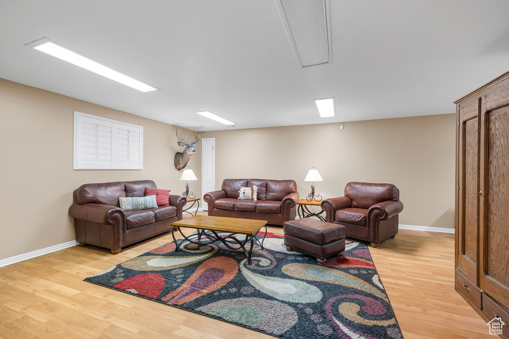 Living room with light hardwood / wood-style floors