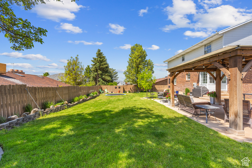 View of yard with a patio area