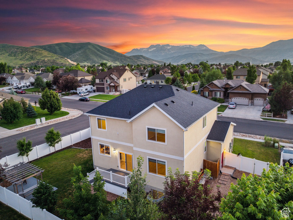 Aerial view at dusk featuring a mountain view