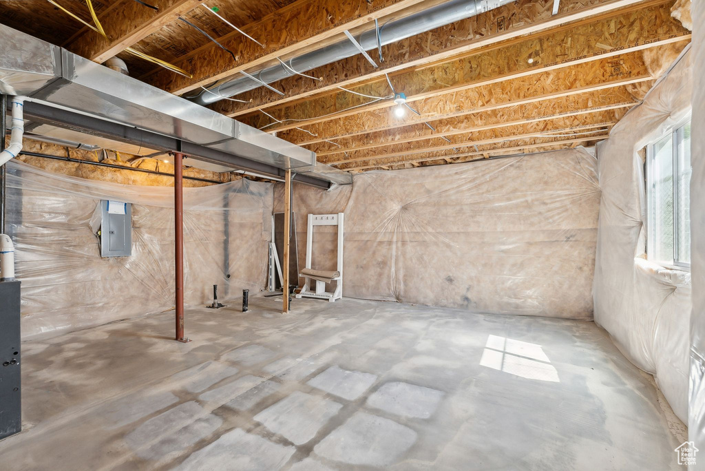 Basement featuring electric panel