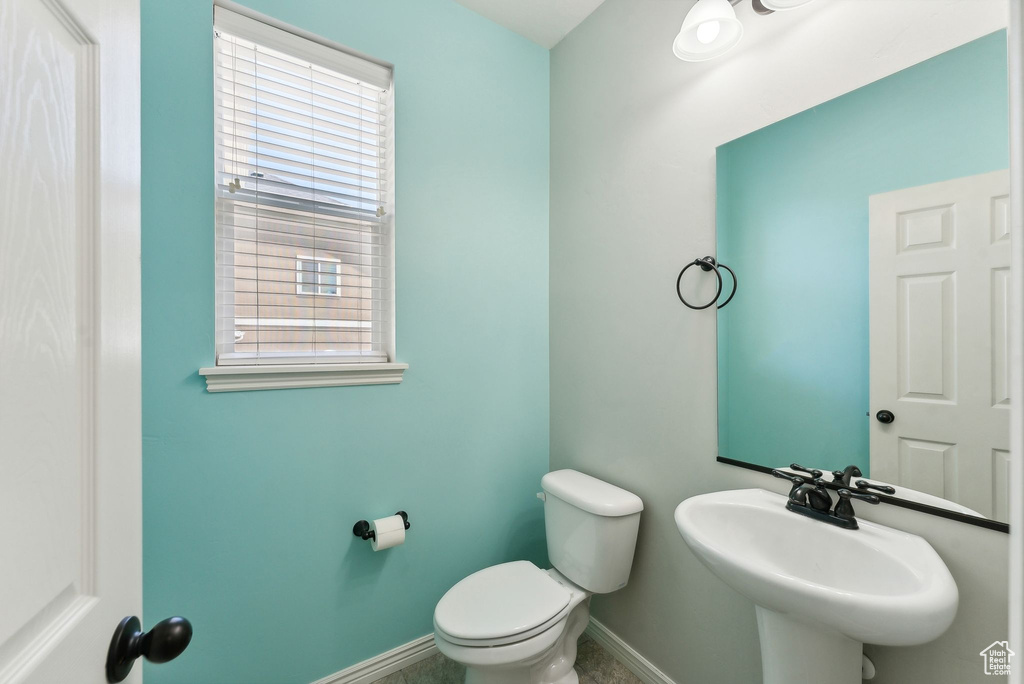 Bathroom with sink and toilet