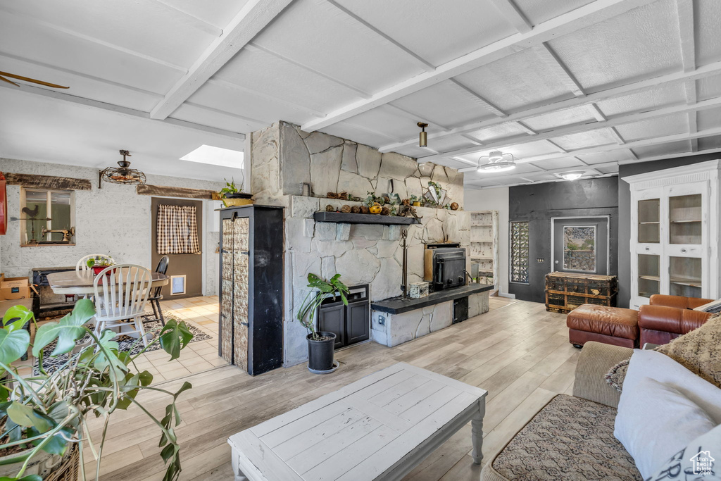 Living room with light hardwood / wood-style floors