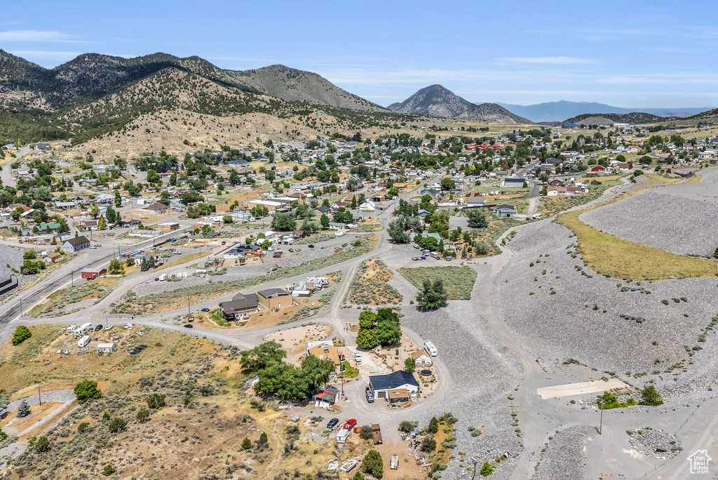 Birds eye view of property with a mountain view