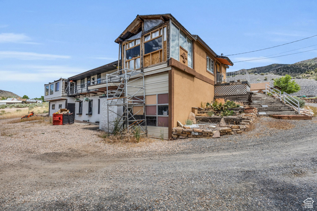 Exterior space featuring a mountain view