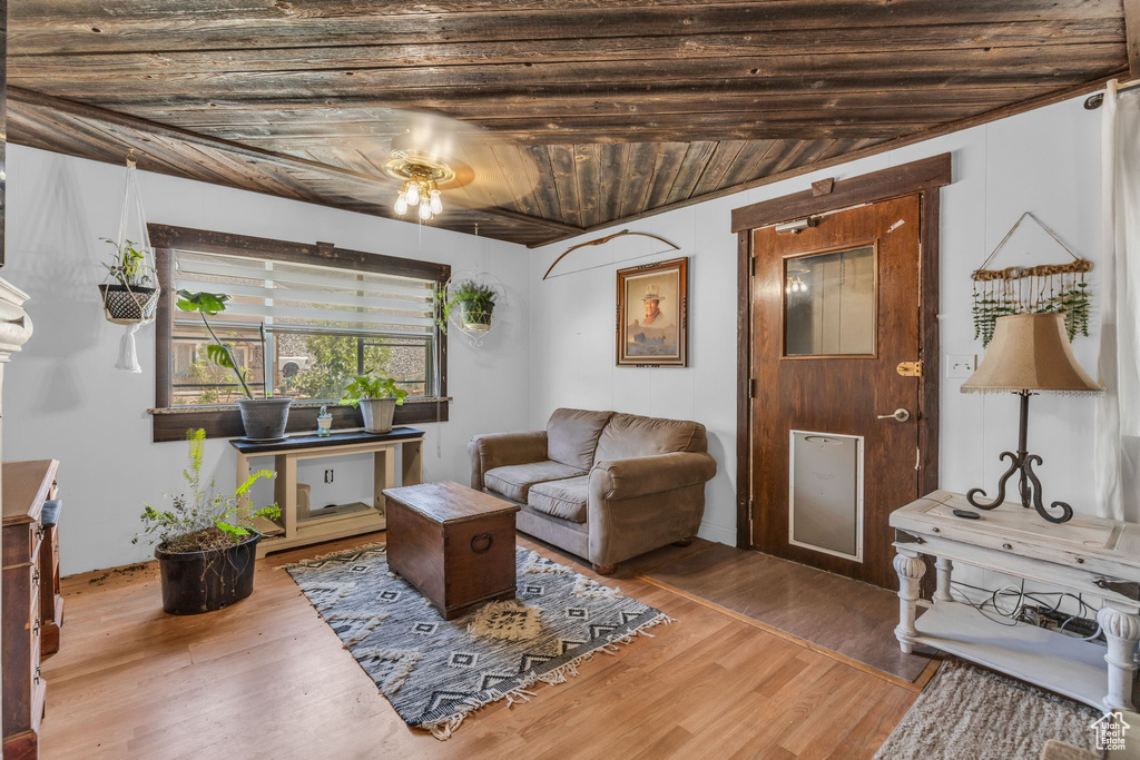 Living room featuring hardwood / wood-style flooring and wood ceiling