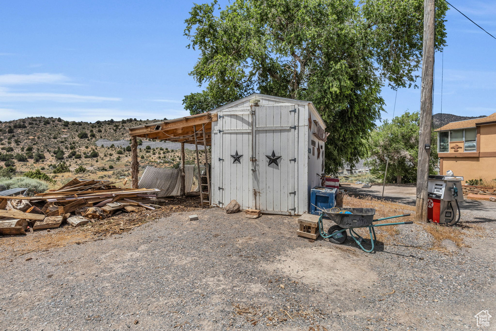 View of outbuilding with a mountain view