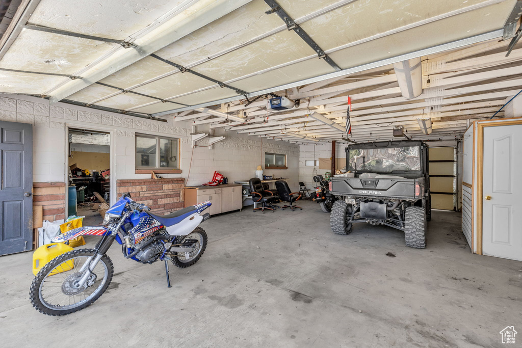 Garage featuring a garage door opener