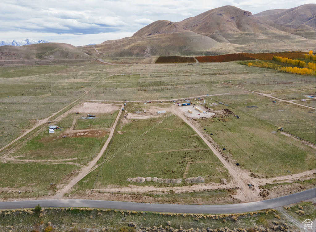 Birds eye view of property with a mountain view and a rural view