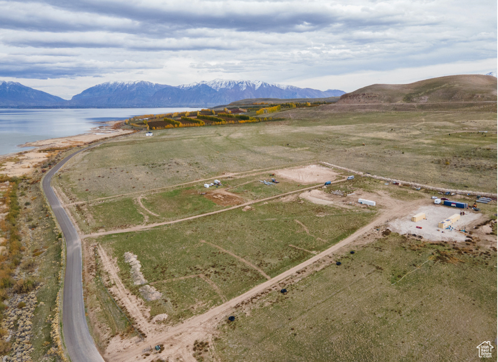 Aerial view with a water and mountain view and a rural view