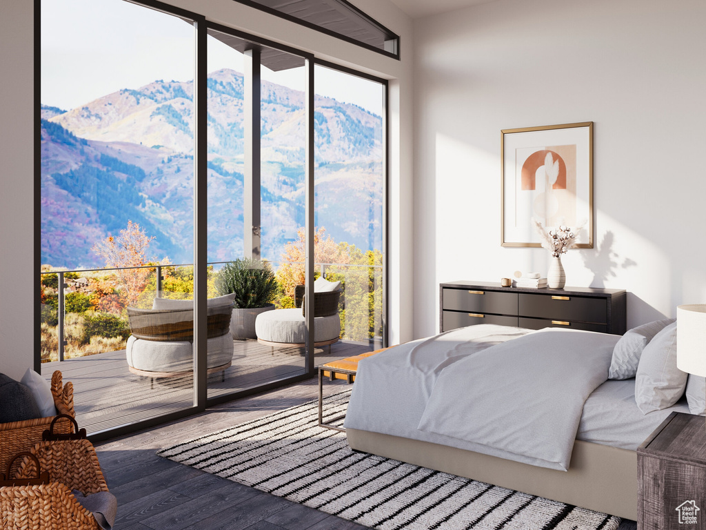 Bedroom featuring a mountain view and wood-type flooring